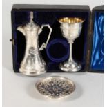 A VICTORIAN ENGRAVCED THREE PIECE COMMUNION SET in a blue velvet lined box. Birmingham 1890.