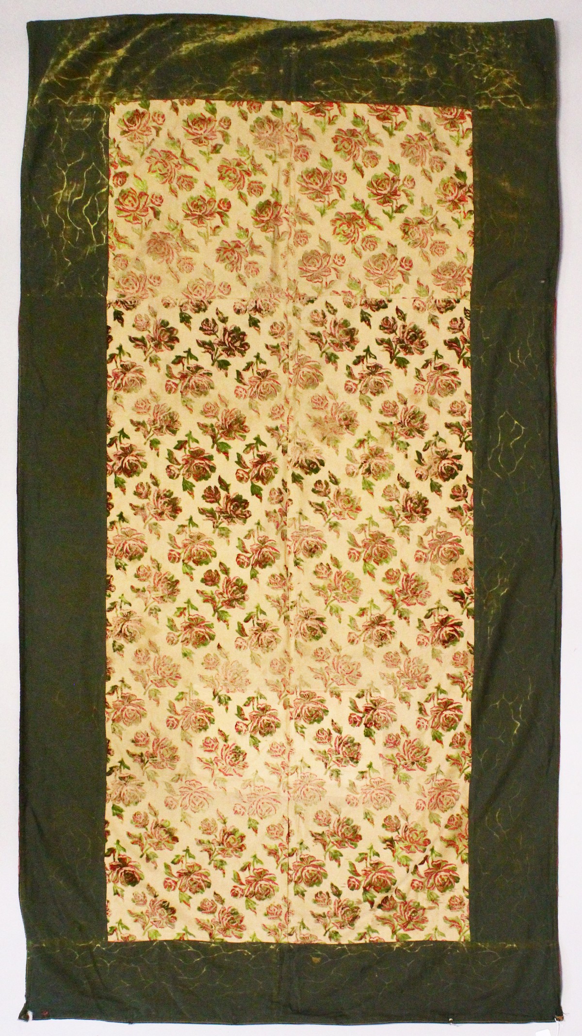 AN EARLY 20TH CENTURY SPANISH TEXTILE, cream ground, embroidered with velvet roses in green and red,