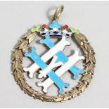 A RUSSIAN SILVER GILT AND ENAMEL DECORATED MONOGRAMMED PENDANT. 1.75ins diameter.