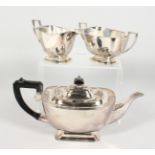 A PLATED THREE PIECE TEA SERVICE of Art Deco design.