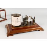 AN EARLY 20TH CENTURY MAHOGANY CASED BAROGRAPH. 15ins long.