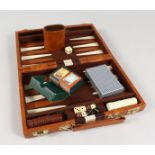 A LEATHER CASED BACKGAMMON SET.