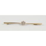 A GOLD AND DIAMOND CLUSTER BAR BROOCH.