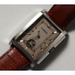 A GENTLEMAN'S FOSSIL WRISTWATCH with leather strap.