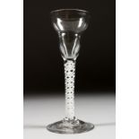 A GEORGIAN WINE GLASS with unusual shaped bowl and white air twist stem. 6ins high.