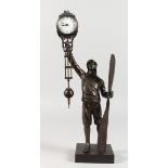 A "MYSTERY" STYLE BRONZE CLOCK, modelled as an aviator standing by a propeller. 15ins high.