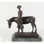 A BRONZE GROUP OF A YOUNG GIRL STANDING BESIDE A DONKEY, mounted on a marble base. 13ins long.