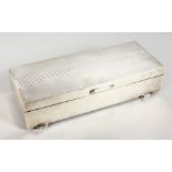 A LARGE ENGINE TURNED SILVER TWO DIVISION CIGARETTE BOX. 9ins long. Birmingham 1964.