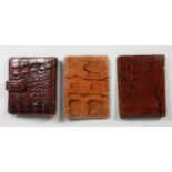 THREE CROCODILE AND SNAKESKIN WALLETS/NOTEBOOKS. 5ins wide