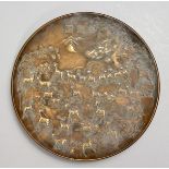 A CHINESE CAST BRONZE CIRCULAR DISH, decorated with deer in a landscape. 7ins diameter.