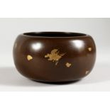 A CHINESE GOLD SPLASH CIRCULAR BRONZE CENSER. 4.5ins diameter.