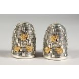 A PAIR OF .925 SILVER PLATE BEEHIVE SALT AND PEPPERS.