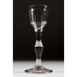 A GEORGIAN WINE GLASS with plain bowl and stem, with a knop. 6ins high.