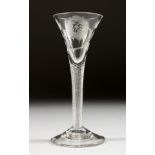 A VERY GOOD JACOBITE WINE GLASS, the trumpet bowl engraved with a rose and leaves, with an air twist
