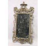 A CHINESE CHIPPENDALE REVIVAL PIER MIRROR, with pointed and parcel gilded carved frame. 5ft 4ins