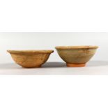 TWO EARLY CHINESE TERRACOTTA BOWLS.