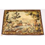 A CONTINENTAL TAPESTRY WALL HANGING with a wooded river landscape, classical ruins and birds. 5ft