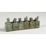 SIX MINIATURE CHINESE BRONZE SEALS / SCROLL WEIGHTS.