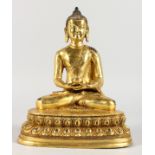 A THAI GILT BRONZE BUDDHA, seated in the lotus position. 9ins high.