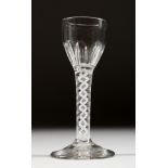 A GEORGIAN WINE GLASS with fluted bowl and white air twist stem. 5.25ins high.