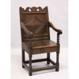 A 17TH CENTURY OAK WAINSCOTT CHAIR, with shaped cresting rail, carved back panel, the solid seat