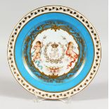 A GOOD SEVRES CABINET PLATE, the centre with a gilt monogram, with a cherub to each side within a