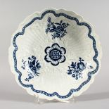 A FIRST PERIOD WORCESTER BLUE AND WHITE JUNKET BOWL with raised decoration. Crescent mark in blue.