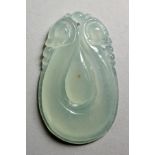 A CHINESE PALE CELADON JADE CARVED PENDANT. 2ins high.