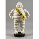 A CAST IRON AND PAINTED MODEL OF THE MICHELIN MAN.
