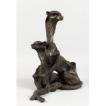 A BRONZE ABSTRACT GROUP, a pair of cheetahs.