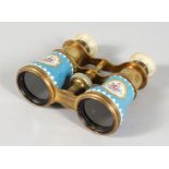 A SUPERB PAIR OF SEVRES PORCELAIN OPERA GLASSES, pale blue with vignettes of flowers and mother-of-