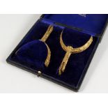 A PAIR OF GILT PRESENTATION SPURS, in a fitted case labelled MAXWELL, 8 DOVER STREET PICCADILLY W.