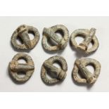 SIX SMALL ROMAN METAL BUCKLES.