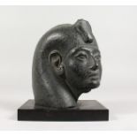 A LOUVRE COPY OF A PHARAOH on a marble base. 7ins high.