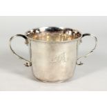 A GEORGE I TWO HANDLED CIRCULAR PORRINGER, open scroll handles with beadwork, engraved A & B on