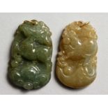TWO SMALL CHINESE CARVED JADE PENDANTS. 1.5ins high,