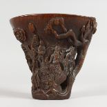 A CARVED HORN LIBATION CUP. 5ins high.