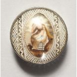 A SMALL GEORGIAN SILVER CIRCULAR PILL BOX with enamel top. 1ins diameter.