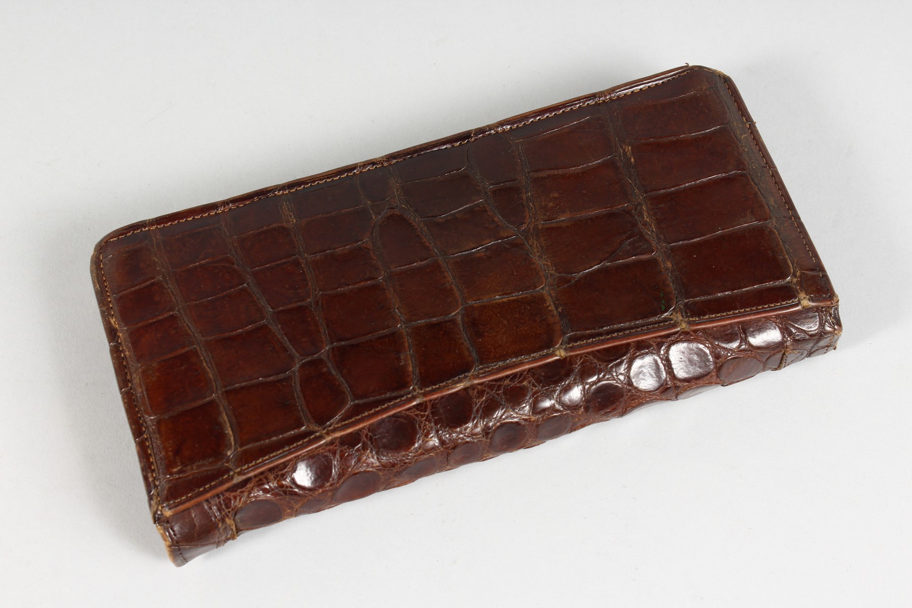 A LADIES CROCODILE LEATHER PURSE, wit silver mount. 8ins long. - Image 2 of 5