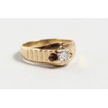 A 9CT YELLOW GOLD DIAMOND SOLITAIRE RING.