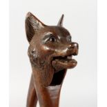 A VERY GOOD BLACK FOREST CARVED WOOD FOX HEAD NUT CRACKERS with glass eyes. 8ins long.
