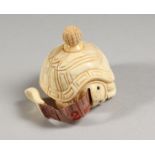 A CARVED BONE TORTOISE TAPE MEASURE.