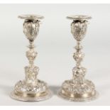 A PAIR OF PLAIN CAST CANDLESTICKS OF CLASSICAL DESIGN. 6.5ins high.