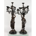 CHARLES CUMBERWORTH (1811-1852) A PAIR OF NUBIAN ORIENTALIST BRONZE CANDELABRA, cast as Nubian women