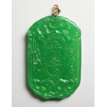 A CHINESE CARVED APPLE GREEN JADE PENDANT. 2.25ins high.