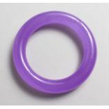 A PLAIN LAVENDER JADE BANGLE. 3.5ins diameter.