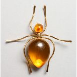 AN AMBER SPIDER BROOCH.