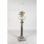 A GOOD CORINTHIAN COLUMN OIL LAMP with glass reservoir.