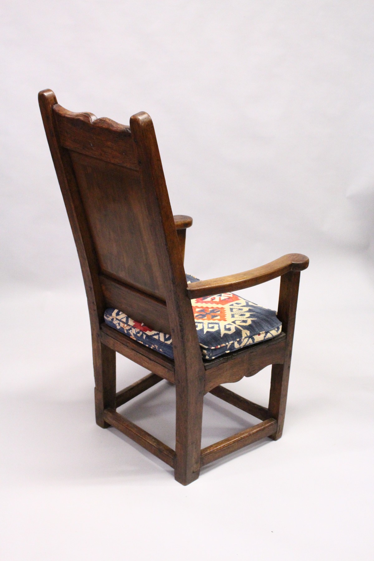 A 17TH / 18TH CENTURY LAMBING CHAIR, possibly fruitwood, with shaped cresting, plain panel back, - Image 3 of 3