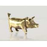 A BRASS PIG SHAPE VESTA CASE.